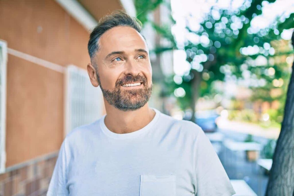 happy man outside healthy teeth smiling white straight teeth