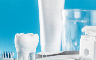 Items such as tooth brush, floss, and more that represent the importance of oral health