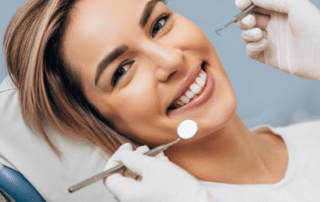 Woman smiling at the dentist, representing dental crown