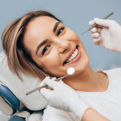 Woman smiling at the dentist, representing dental crown